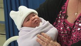 Leoni and family bond with the baby